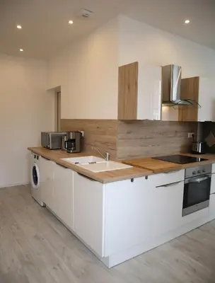 Cuisine ou kitchenette dans l'établissement La Maison de Jules