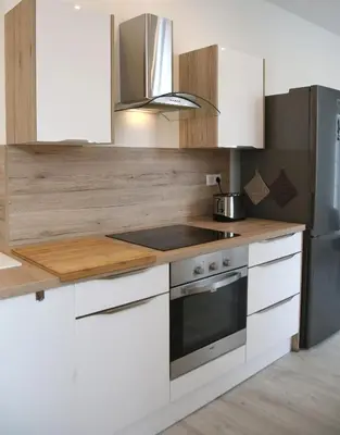 Cuisine ou kitchenette dans l'établissement La Maison de Jules