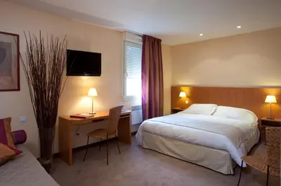 Un ou plusieurs lits dans un hébergement de l'établissement Hotel l'Orée Des Vignes