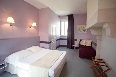 Un ou plusieurs lits dans un hébergement de l'établissement Hotel l'Orée Des Vignes