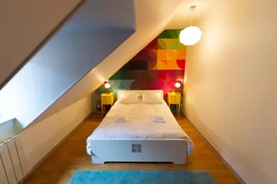 Un ou plusieurs lits dans un hébergement de l'établissement APPARTEMENT LE VITAMINE - topbnb dijon