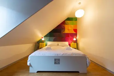 Un ou plusieurs lits dans un hébergement de l'établissement APPARTEMENT LE VITAMINE - topbnb dijon