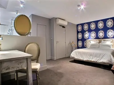 Un ou plusieurs lits dans un hébergement de l'établissement Hôtel 19'Cent