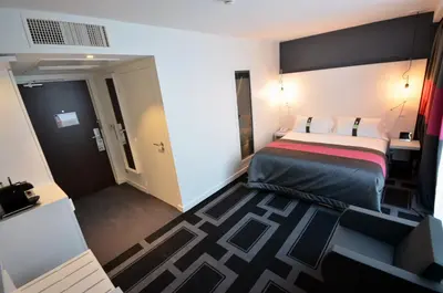 Un ou plusieurs lits dans un hébergement de l'établissement Holiday Inn Dijon Toison D'or by IHG
