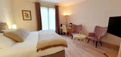 Un ou plusieurs lits dans un hébergement de l'établissement Demeures & Châteaux - Hôtel Greuze & Spa Tournus