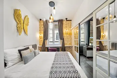 Un ou plusieurs lits dans un hébergement de l'établissement La Suite Indivio - Appartement standing vue cathédrale