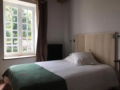 Un ou plusieurs lits dans un hébergement de l'établissement Orangerie du chateau de Quemigny sur Seine