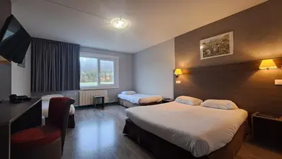 Un ou plusieurs lits dans un hébergement de l'établissement Hotel Val Vert
