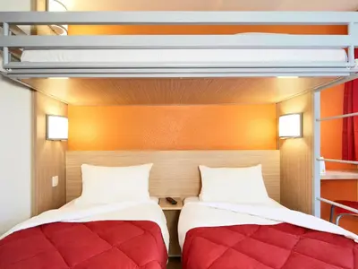Un ou plusieurs lits dans un hébergement de l'établissement Premiere Classe Dijon Sud - Marsannay