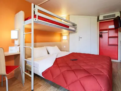 Un ou plusieurs lits dans un hébergement de l'établissement Premiere Classe Dijon Sud - Marsannay