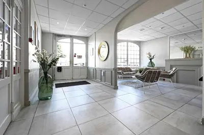 Coin salon dans l'établissement Hôtel le Terminus et son restaurant Côte à Côte - Chambres rénovées
