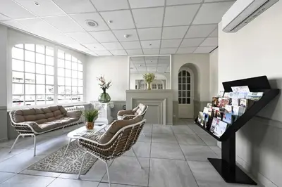 Coin salon dans l'établissement Hôtel le Terminus et son restaurant Côte à Côte - Chambres rénovées