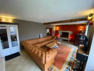 Coin salon dans l'établissement Domaine Les Hauts Prés