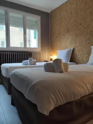 Un ou plusieurs lits dans un hébergement de l'établissement BAR HOTEL DU CENTRE (BDC)