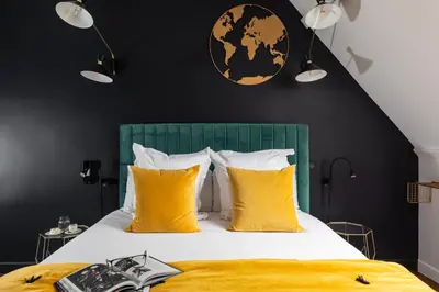 Un ou plusieurs lits dans un hébergement de l'établissement Hôtel - Restaurant Le Globe