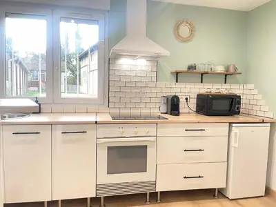Cuisine ou kitchenette dans l'établissement Le Duplex Cosy - Gare & Cité Gastronomique