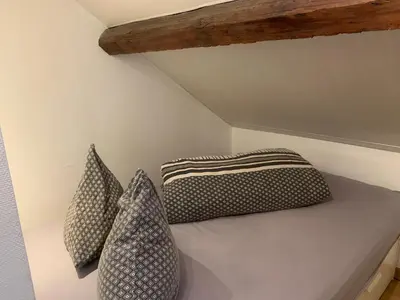 Un ou plusieurs lits dans un hébergement de l'établissement Le Duplex Cosy - Gare & Cité Gastronomique