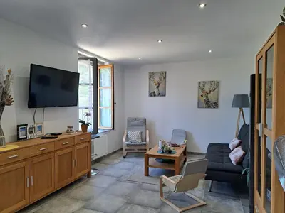 Télévision ou salle de divertissement dans l'établissement Gîte Le piège à rêves