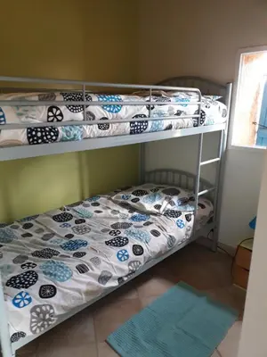 Un ou plusieurs lits dans un hébergement de l'établissement Gite de Pêche