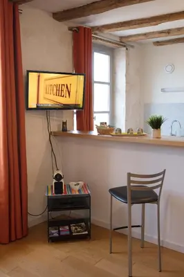 Télévision ou salle de divertissement dans l'établissement Appartement A-Mi-Chemin - Centre-ville de Tournus