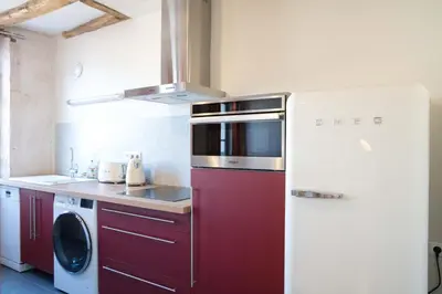 Cuisine ou kitchenette dans l'établissement Appartement A-Mi-Chemin - Centre-ville de Tournus