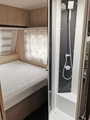 Un ou plusieurs lits dans un hébergement de l'établissement CAMPING LES HERLEQUINS