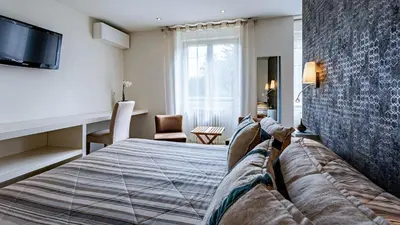 Un ou plusieurs lits dans un hébergement de l'établissement Hostellerie Saint Germain