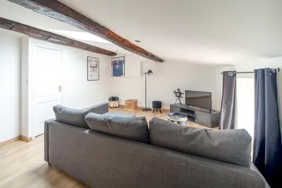 Coin salon dans l'établissement Myappart71 - Appartement - cosy au centre ville