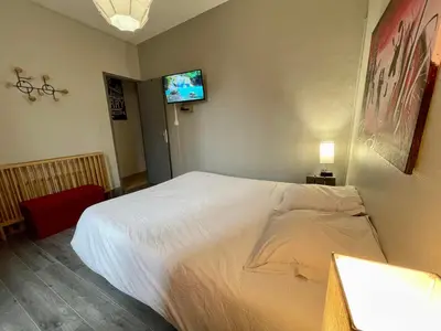 Un ou plusieurs lits dans un hébergement de l'établissement Appartements chez Delphine et Guillaume au coeur de Semur en Auxois