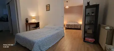 Un ou plusieurs lits dans un hébergement de l'établissement Appartement confort deux Etoiles