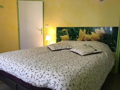 Un ou plusieurs lits dans un hébergement de l'établissement Chambres d'Hôtes Pom' Paille