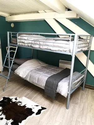 Un ou plusieurs lits dans un hébergement de l'établissement Charmant duplex 100m2