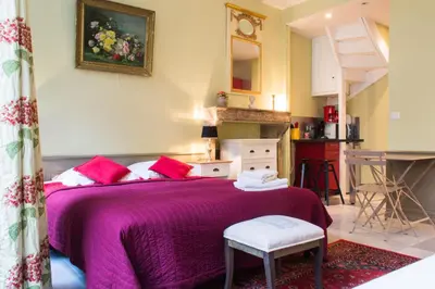 Un ou plusieurs lits dans un hébergement de l'établissement Appartement - Petit Buffon