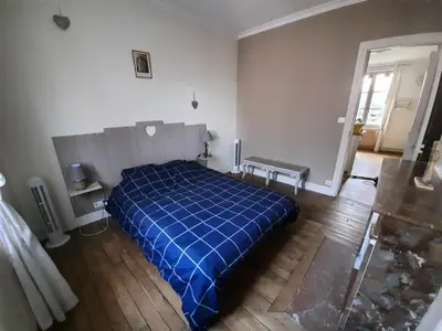 Un ou plusieurs lits dans un hébergement de l'établissement Joli appartement meublé