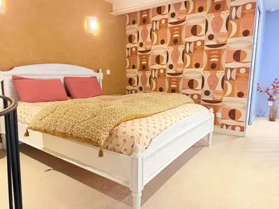 Un ou plusieurs lits dans un hébergement de l'établissement Le Chouette Loft