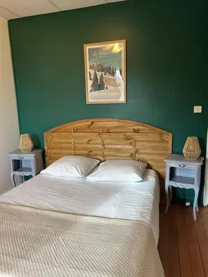 Un ou plusieurs lits dans un hébergement de l'établissement Hôtel l'Annexe