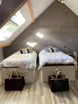 Un ou plusieurs lits dans un hébergement de l'établissement Maison d'hôtes à la Ferme Une Pause à la Guette