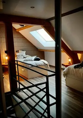 Un ou plusieurs lits dans un hébergement de l'établissement Maison d'hôtes à la Ferme Une Pause à la Guette