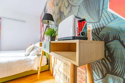Un ou plusieurs lits dans un hébergement de l'établissement Le Pop Art - Topbnb Dijon
