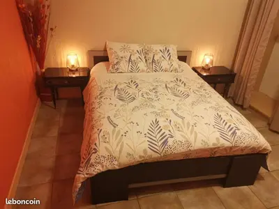 Un ou plusieurs lits dans un hébergement de l'établissement Charmant appartement dans maison de village