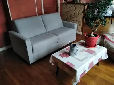 Coin salon dans l'établissement Chambre meublée au cœur de ville - chez l'habitant