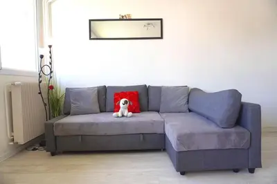 Coin salon dans l'établissement Appartement La Roseraie PARKING PRIVE