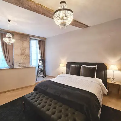Un ou plusieurs lits dans un hébergement de l'établissement La Dolce Vita Spa privatif