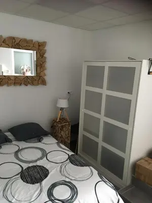Un ou plusieurs lits dans un hébergement de l'établissement L’appartement charmant