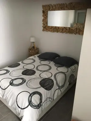 Un ou plusieurs lits dans un hébergement de l'établissement L’appartement charmant