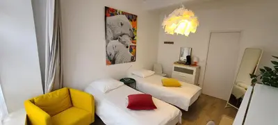 Un ou plusieurs lits dans un hébergement de l'établissement Chambre de charme à Saulieu