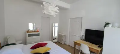 Un ou plusieurs lits dans un hébergement de l'établissement Chambre de charme à Saulieu