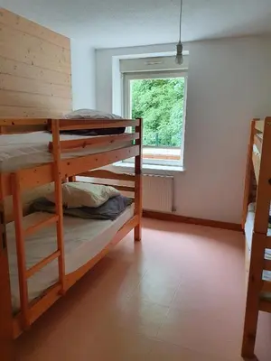 Un ou plusieurs lits dans un hébergement de l'établissement Gîte du Moulin