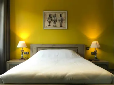 Un ou plusieurs lits dans un hébergement de l'établissement Hotel de l'Abbaye à Cluny