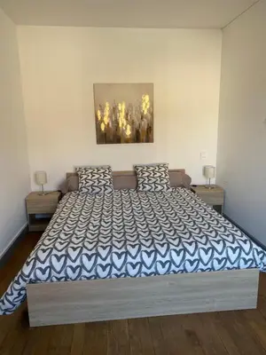 Un ou plusieurs lits dans un hébergement de l'établissement L’appartement de Rose